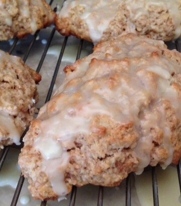 Cinnamon Scones with Orange Glaze on a rack.