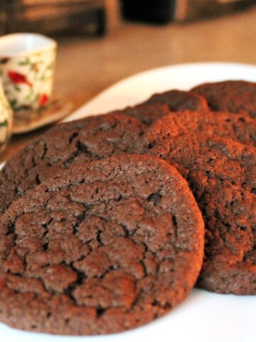 Soft chocolate cookies on a white plate.