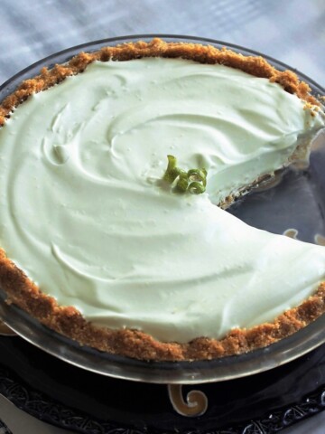 Key Lime pie with a slice out of it.