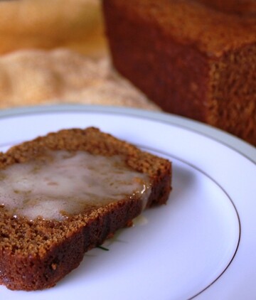 Slice of quick bread with melted butter.