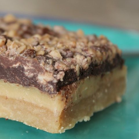 One bar with a shortbread crust, creamy middle and chocolate-toffee crunch top