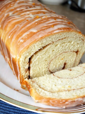 A sliced loaf of orange cinnamon bread.