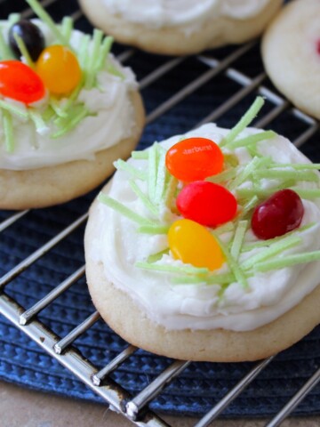 Sugar cookies with frosting and decorated with jelly beans.