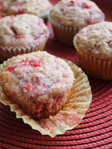 Strawberry Muffins on a red mat.