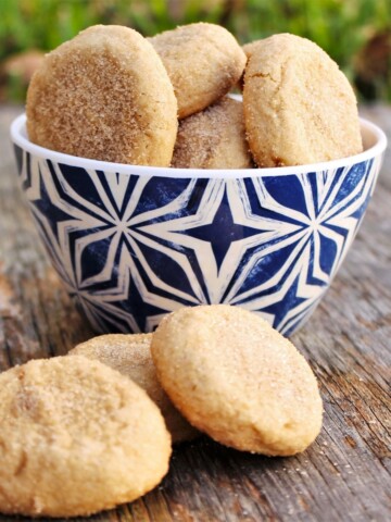 Small bowl full of maple cookies coated in sugar.