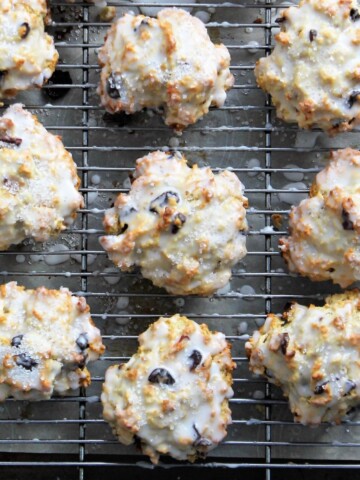Cooling rack full of cherry scones, sprinkled with sugar.