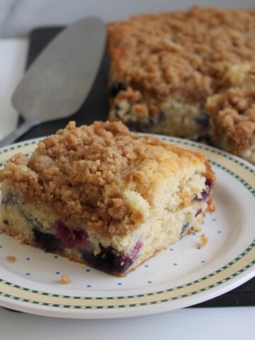 Slice of cake on a colorful plate.