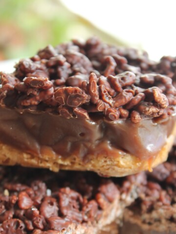 Close up of a gooey, crispy caramel chocolate krispies bar.