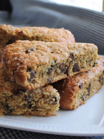 Stack of oatmeal scones on a white plate.