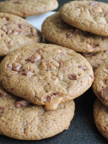 Stack of delicious browned cookies, dripping with toffee.
