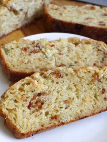 Slices of fresh bread on a white plate.