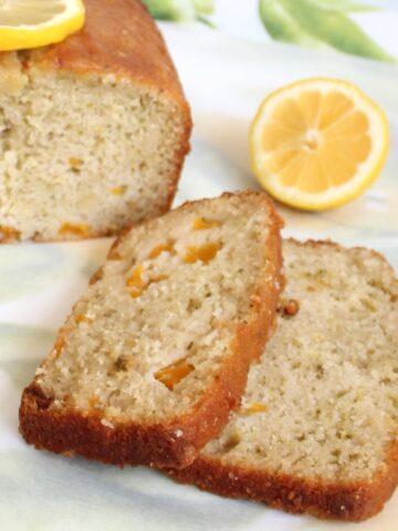 Slices of lemon peach cake with lemon slices.