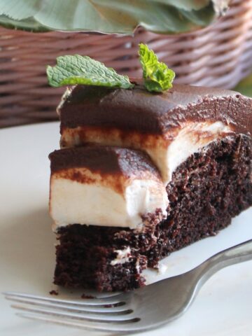 Thick Mint Cookie Cake close up on a white plate.