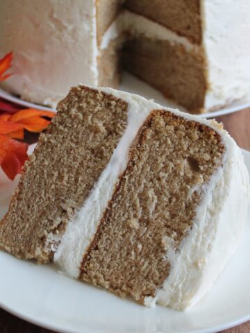 Large slice of spice cake on a white plate.