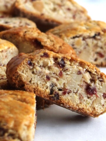 Close up of mini cranberry macadamia nut biscotti.